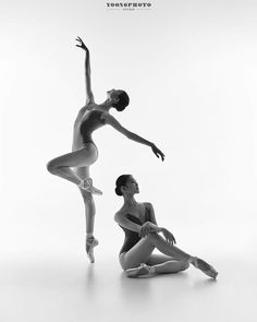 two ballerinas in black and white pose for the camera