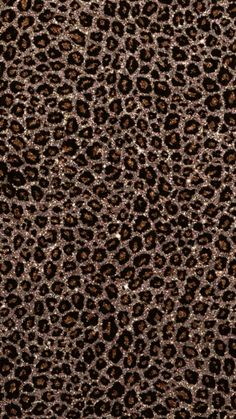 an animal print pattern is shown in brown and black