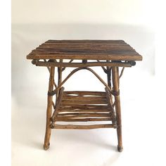 a small wooden table sitting on top of a white floor