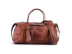 "Our medium size weekend bag in genuine leather for men and women. It is handmade in tanned brown leather. Large enough for extended weekend trips but enough for carry on in flight cabin. Great for anniversary gift for your partner.  FEATURES: # all zipper and hardware made out of dark brass # Adjustable strap - Detachable - with thick padding for comfort. # vegetable tanned leather light brown # handles, trimming and reinforcement in genuine leather.  # Lining in strong canvas, this bag in in c Brown Duffle Bag For Weekend Trips, Leather Weekender Bag With Luggage Sleeve In Cognac, Brown Leather Weekender Bag For Weekend Trips, Brown Leather Weekender Bag For Trips, Brown Weekender Bag With Luggage Sleeve For Weekend Trips, Cognac Leather Weekender Bag With Luggage Sleeve, Brown Weekender Bag With Luggage Sleeve For Everyday Use, Brown Weekender Bag With Leather Trim For Overnight Trips, Brown Leather Trim Weekender Bag For Overnight Trips