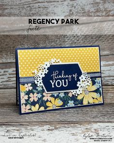 a greeting card with the words thank you written on it and flowers in blue, yellow and white