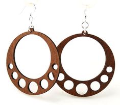 the earrings are made out of wood and have holes in them that look like circles