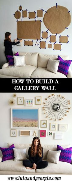 a woman sitting on top of a white couch in front of a wall filled with pictures