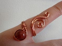 This pretty ring is made with 18 and 23 gauge non tarnish copper wire, and goldstone 8mm bead. This wire wrapped Ring is basically adjustable and will fit just about 7-11 US size finger. But if your finger is a bigger or smaller size , you can ask for custom order. I will make it specially for you. Thanks for looking, hope to do business with you soon ! If you have any questions, please don't hesitate to contact me. Handmade Rings Wire, Bead Business, Wire Wrapping Beads, Wire Rings Tutorial, Rings Wire, Wire Jewelry Earrings, Wire Wrap Ring, Wire Jewelry Patterns, Wire Jewelery