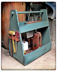 an old tool holder with tools in it