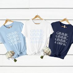 three t - shirts that say game of throne, game of wine and drink on them