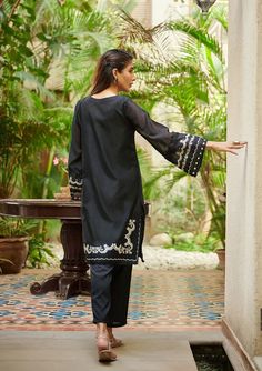 2 Piece Embroidered Suit for Women Description A classic monochromatic design envisioning captivating details that make this two-piece staple a perfect style statement for you and your little one. Kameez (Shirt) : Black Embroidered Paper Cotton Shirt.Lining included. Shalwar (Trouser) : Black Pants. Elegant Cotton Dresses For Eid, Elegant Floral Embroidered Sets For Summer, Elegant Summer Sets With Floral Embroidery, Elegant Floral Embroidered Summer Sets, Elegant Floral Embroidery Sets For Summer, Black Summer Formal Set, Elegant Lawn Suit With Embroidered Long Sleeves, Elegant Lawn Suit With Long Embroidered Sleeves, Fitted Sets With Embroidered Sleeves For Eid