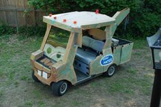 a homemade golf cart made out of cardboard