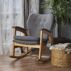 a rocking chair in front of a window