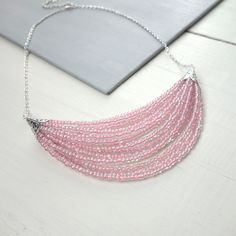 Pink Single Strand Round Beads Necklace, Pink Multi-strand Beads For Jewelry Making, Pink Multi-strand Necklace For Parties, Adjustable Pink Necklace With Large Beads, Pink Multi-strand Beaded Necklace, Pink Multi-strand Beaded Necklace With Faceted Beads, Elegant Statement Necklace, Pink Bead Necklace, Pink Adjustable Multi-strand Necklace