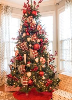 a christmas tree decorated with red and white ornaments