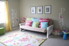 a child's room decorated in pastel colors