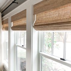 the window sill is covered with bamboo blinds