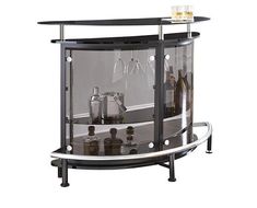 a black and chrome bar cart with wine glasses on the top, liquor bottles behind it