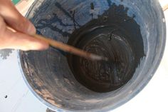 a person stirring chocolate in a blue bowl