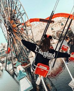 a person standing on top of a ferris wheel