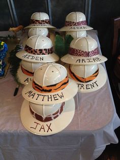 six fireman hats are sitting on a table