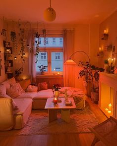 a living room filled with lots of furniture next to a fire place in front of a window