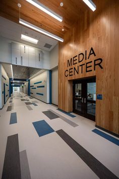 the inside of a building that has a large sign on it's wall and doors