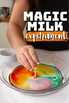 a woman is making an art project with melted paint on a plate and the words, magic milk experiment