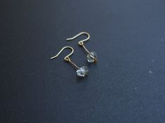 These earrings are made from hand hammered brass drops with a teeny floating Herkimer diamond. The stones are less than 1/2 an inch long and the earrings are just under an inch in length from the hook. The hooks are brass but can be substituted for sensitive hooks upon request. Dainty Faceted Everyday Earrings, Minimalist Crystal Earrings For Everyday, Minimalist Faceted Everyday Earrings, Minimalist Everyday Faceted Earrings, Raw Quartz Crystal, Jewelry Staples, Raw Quartz, Hammered Brass, Drop Pendant Necklace