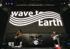 the band wave to earth performing on stage