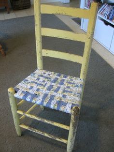 an old wooden chair is painted yellow and blue