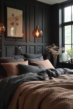 a bedroom with dark wood paneled walls and bedding, two lamps hanging from the ceiling