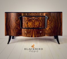 the sideboard is made out of wood and has metal handles