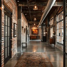 A classic industrial hallway with exposed brick walls, the red bricks contrasting with the metal accents and concrete floors1 Industrial Entrance, Hallway Inspiration, Industrial Style