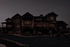 a large house is lit up at night