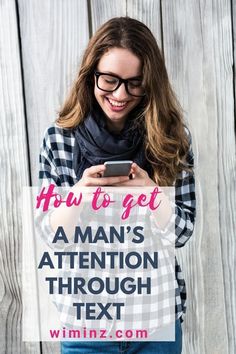 a woman holding a cell phone with the text how to get a man's attention through text