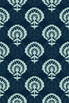 a blue and white wallpaper with an intricate design on it's back ground