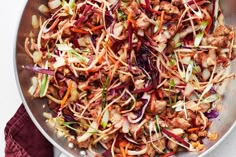 a pan filled with meat and veggies on top of a table