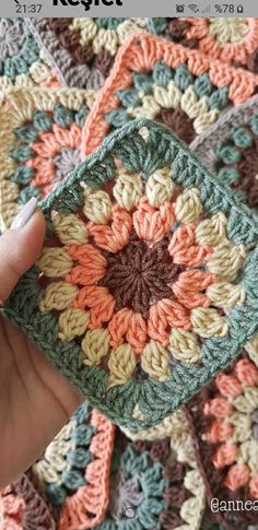 a crocheted blanket with flowers on it