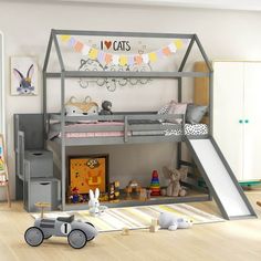 a child's bedroom with a bunk bed, slide and toy cars on the floor