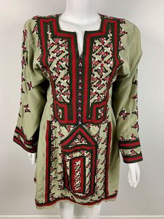 Afghan Vintage Balochi Embroidered Dress Size: Length: 37 inches  Bust (front): 17.5 Sleeve Length: 22 Shoulders: 16 Green Long Sleeve Embroidered Dress With Resham Embroidery, Folk Style Long Sleeve Fitted Embroidered Dress, Folk Style Fitted Embroidered Dress With Long Sleeves, Folk Style Fitted Embroidered Long Sleeve Dress, Green Long Sleeve Dress With Intricate Embroidery, Long Green Embroidered Dress, Green Floral Embroidered Tunic For Spring, Green Embroidered Dress For Spring, Green Long Sleeve Tunic With Floral Embroidery