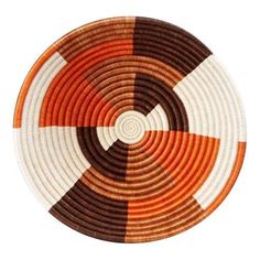 an orange, brown and white plate on a white background