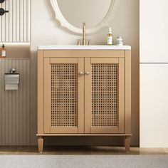 a bathroom with a sink, mirror and cabinet next to the toilet paper dispenser