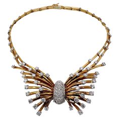 Created by Gubelin in Switzerland at some time during the 1940's, this incredible necklace bespeaks elegance and quiet opulence. It is a piece of jewelry that absolutely needs to be seen in hand, to understand the incredible level of attention to detail and workmanship that went into it's creation. Set with a total of approximately 10.75ct brilliant cut diamonds of overall G/H color and VS1 clarity. It exudes the classic style of the period with a cinched explosion of diamonds at the center and with a line of double diamonds mounted between each columnar link. Every diamond is mounted in either a platinum plate or head, adding to the perceived quality of this jewel. Total length is 16 inches and maximum width is in excess of 1 1/4 inches. The plunger clasp is hand signed Gubelin and bears Antique Necklaces, Double Diamond, Vintage Necklaces, Antique Necklace, G H, Gold Platinum, Brilliant Cut Diamond, 18k Rose Gold, Vintage Necklace