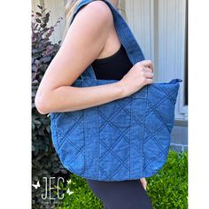 Carry your essentials in style with our Quilted Denim Tote Bag! Made from fashionable padded denim fabric, this tote features a top zipper closure, one zipper interior pocket, and two quick access pockets in the lining. The easy access exterior side pocket adds convenience to this sophisticated and exclusive piece. Stylish and functional, this bag is a must-have accessory for any fashion-forward individual! Shoulder Drop 11" Denim Tote Shoulder Bag With Zipper Closure, Everyday Denim Bags With Zipper Closure, Denim Blue Canvas Shoulder Bag With Zipper, Everyday Denim Shoulder Bag With Zipper, Denim Blue Shoulder Bag With Zipper For Everyday Use, On-the-go Denim Bag With Zipper Closure, Denim Bags With Zipper Closure, Denim Blue Bags With Zipper Closure For Everyday Use, Denim Blue Bags For Everyday Use