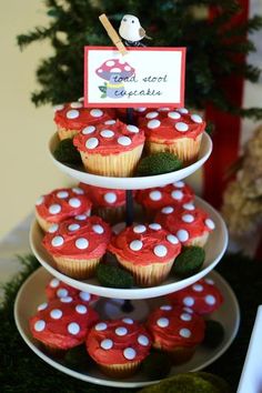 cupcakes are stacked on top of each other in the shape of mushroomes