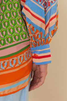 Embrace vibrant elegance with the Cashew Mix Long Sleeve Shirt, a mesmerizing dance of print and color that evokes Brazil's joyful spirit. Its bold cashew motifs are artfully placed against an array of geometric patterns, creating a harmonious clash that sings on the luxurious fabric. This piece features a classic collar neckline, anchoring the vivacious design, while the relaxed silhouette offers both comfort and a touch of sophistication. Composition 100% VISCOSE Care Instructions MACHINE WASH, DO NOT BLEACH, DO NOT TUMBLE DRY, IRON AT MEDIUM HEAT, DO NOT DRY CLEAN, LINE DRY Size and Fit Inches XXS XS S M L XL Bust 45 46 3/4 48 3/4 50 3/4 54 57 Waist 45 46 3/4 48 3/4 50 3/4 54 57 Length 27 2/4 28 1/4 28 3/4 29 1/4 30 30 2/4 Hip 45 46 3/4 48 3/4 50 3/4 57 57 " Clashing Patterns, Pattern Clash, Printed Dresses, Farm Rio, Cashew, Geometric Patterns, Luxury Fabrics, Lifestyle Brands, Long Sleeve Shirt