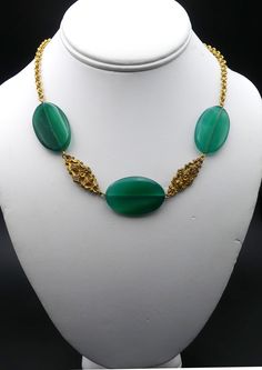 "Vintage gold tone and large green agate necklace ( A ), In good vintage condition. Necklace 18\" long, 2\" Extended. Green agate 1\"3/8 x 7/8 and 5 mm thick. 1\" ¼ x 7/8\" and 5 mm thick. Weighs 1.1 Oz. Thanks." Formal Gold Jade Necklaces, Formal Gold Jade Necklace, Formal Yellow Gold Jade Necklace, Handmade Yellow Gold Jade Necklaces, Handmade Yellow Gold Jade Necklace, Elegant Gold Beaded Necklaces With Green Onyx, Elegant Gold Beaded Necklace With Green Onyx, Oval Jade Gold Necklace, Formal Necklace With Natural Stones And Agate