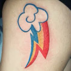 a colorful tattoo on the back of a woman's leg with a cloud and lightning