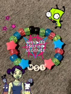 an image of a bracelet with cartoon characters on it and the words mssi spelled out