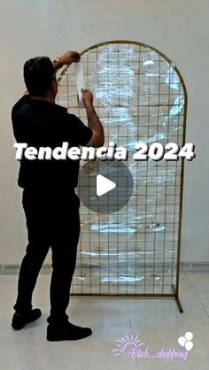 a man standing in front of a screen with the words tenddentia 2024 on it