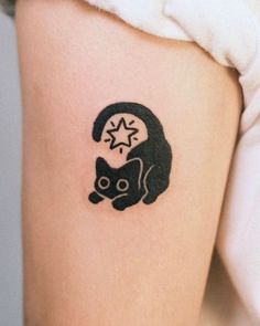 a black cat tattoo on the right thigh