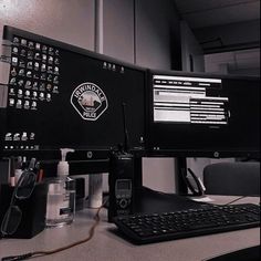 a computer monitor sitting on top of a desk next to a keyboard and mouse,