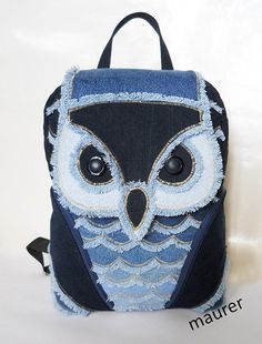 an owl backpack is shown on a white background